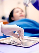 A woman with a toothache seeing her dentist