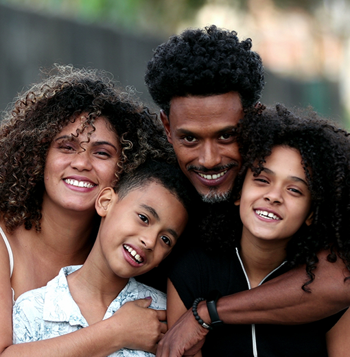 Four young adults smiling