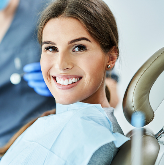 Woman smiling in the dental chair