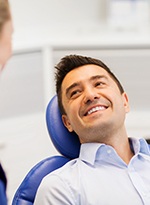 Man smiles at dentist