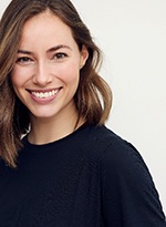 Close-up of smiling woman in black shirt