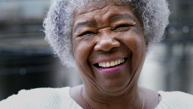 patient smiling after having ill-fitting dentures fixed